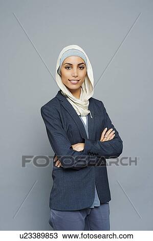 Studio portrait of young businesswoman wearing hijab View Large Photo Image Stock Image - Studio portrait of young businesswoman wearing hijab. Fotosearch