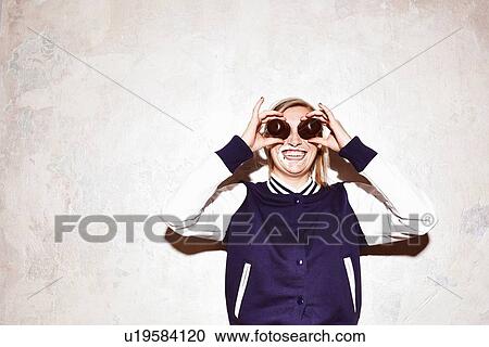 Studio portrait of young woman making eyes with chocolate marshmallows View Large Photo Image Stock Image - Studio portrait of young woman making eyes with chocolate marshmallows. Fotosearch