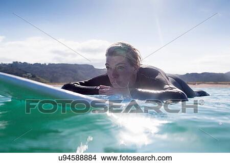 "Surfer in the water, Bay of Islands, NZ" View Large Photo Image Picture - "Surfer in the water, Bay of Islands, NZ". Fotosearch