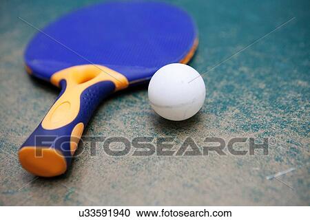 Table tennis paddle and ball on worn table View Large Photo Image Stock Image - Table tennis paddle and ball on worn table. Fotosearch