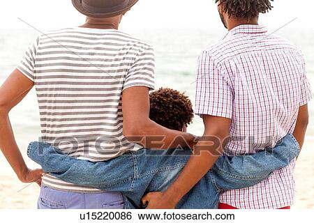 Three generation family enjoying beach View Large Photo Image Stock Photograph - Three generation family enjoying beach. Fotosearch