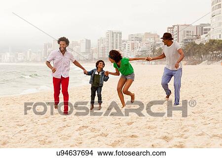 "Three generation family enjoying beach, Rio de Janeiro, Brazil" View Large Photo Image Picture - "Three generation family enjoying beach, Rio de Janeiro, Brazil". Fotosearch