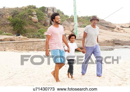 "Three generation family enjoying beach, Rio de Janeiro, Brazil" View Large Photo Image Stock Image - "Three generation family enjoying beach, Rio de Janeiro, Brazil". Fotosearch