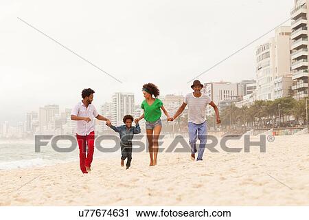 "Three generation family enjoying beach, Rio de Janeiro, Brazil" View Large Photo Image Stock Image - "Three generation family enjoying beach, Rio de Janeiro, Brazil". Fotosearch