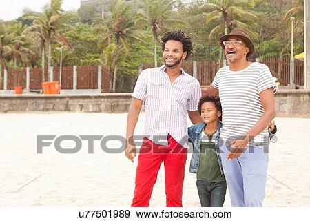 Stock Photo - "Three generation family enjoying beach, Rio de Janeiro, Brazil". Fotosearch