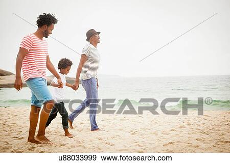 Stock Photo - "Three generation family enjoying beach, Rio de Janeiro, Brazil". Fotosearch