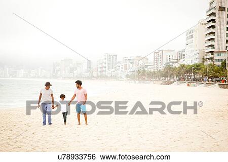 "Three generation family enjoying beach, Rio de Janeiro, Brazil" View Large Photo Image Stock Photograph - "Three generation family enjoying beach, Rio de Janeiro, Brazil". Fotosearch