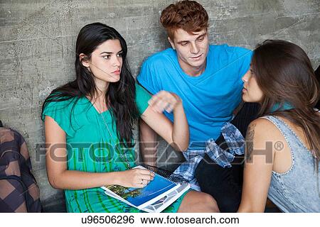 Stock Photograph - Three students talking. Fotosearch