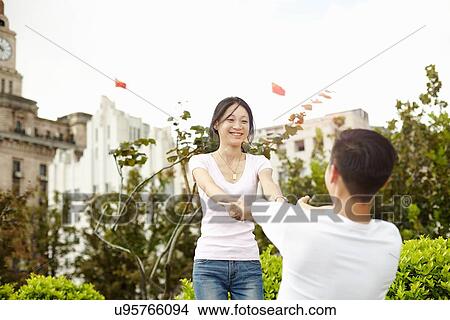 "Tourist couple dancing, The Bund, Shanghai, China" View Large Photo Image Picture - "Tourist couple dancing, The Bund, Shanghai, China". Fotosearch