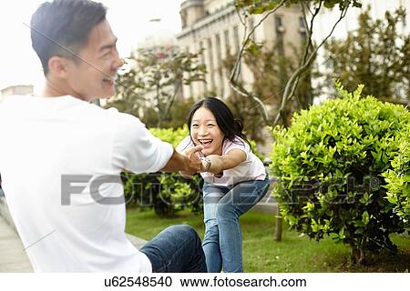 "Tourist couple laughing and dancing, The Bund, Shanghai, China" View Large Photo Image Stock Image - "Tourist couple laughing and dancing, The Bund, Shanghai, China". Fotosearch