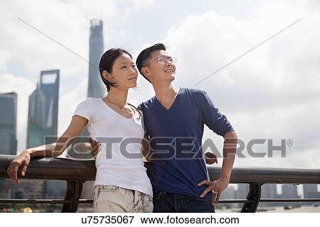 "Tourist couple looking up, The Bund, Shanghai, China" View Large Photo Image Stock Photo - "Tourist couple looking up, The Bund, Shanghai, China". Fotosearch