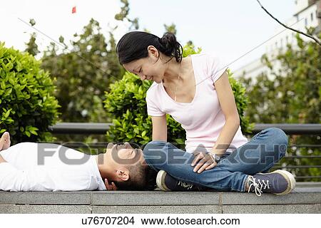 "Tourist couple sitting and lying on wall, The Bund, Shanghai, China" View Large Photo Image Picture - "Tourist couple sitting and lying on wall, The Bund, Shanghai, China". Fotosearch