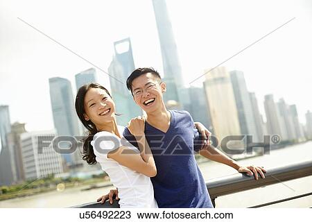 "Tourist couple smiling on bridge, The Bund, Shanghai, China" View Large Photo Image Stock Image - "Tourist couple smiling on bridge, The Bund, Shanghai, China". Fotosearch