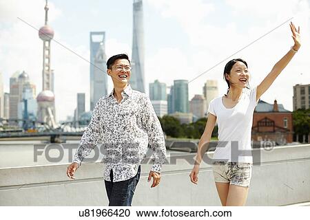 "Tourist couple waving, The Bund, Shanghai, China" View Large Photo Image Stock Image - "Tourist couple waving, The Bund, Shanghai, China". Fotosearch