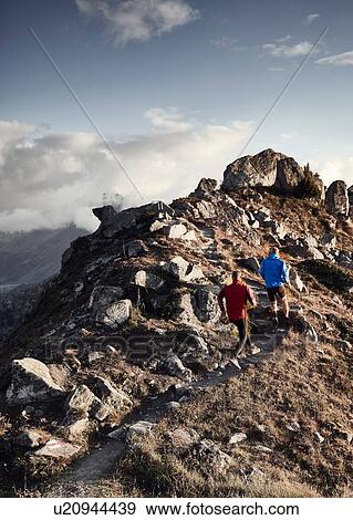 "Trail runners on rocky path, Valais, Switzerland" View Large Photo Image Stock Photo - "Trail runners on rocky path, Valais, Switzerland". Fotosearch