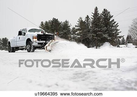 Stock Photography - Truck clearing snow. Fotosearch