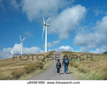 Two brothers walking on path at windfarm View Large Photo Image Stock Photography - Two brothers walking on path at windfarm. Fotosearch