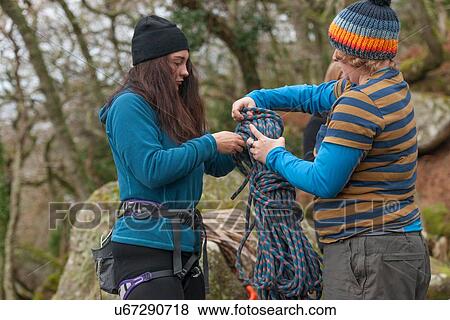 Two female rock climbers holding rope View Large Photo Image Stock Photo - Two female rock climbers holding rope. Fotosearch