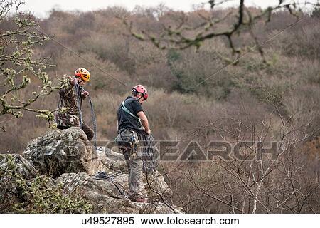 Two male rocks climbers with ropes View Large Photo Image Stock Photography - Two male rocks climbers with ropes. Fotosearch