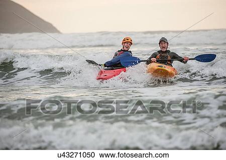 Two men sea kayaking View Large Photo Image Stock Image - Two men sea kayaking. Fotosearch