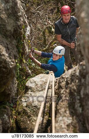 Two people rock climbing View Large Photo Image Stock Photography - Two people rock climbing. Fotosearch