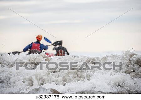 Two people sea kayaking View Large Photo Image Stock Photograph - Two people sea kayaking. Fotosearch