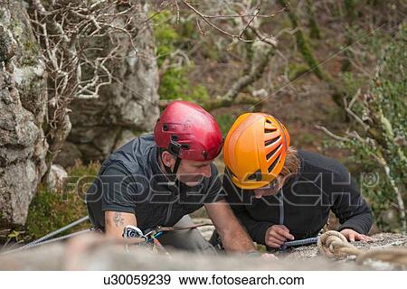 Stock Photo - "Two rock climbers, high angle". Fotosearch