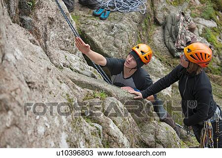 Two rock climbers planning route View Large Photo Image Stock Image - Two rock climbers planning route. Fotosearch