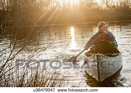 Two women canoeing View Large Photo Image Stock Photo - Two women canoeing. Fotosearch