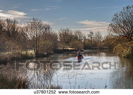 Two women in canoe on river View Large Photo Image Stock Image - Two women in canoe on river. Fotosearch