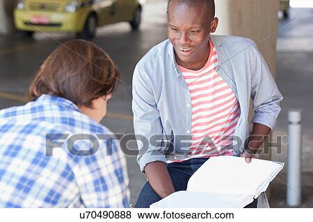Two young men studying View Large Photo Image Stock Photo - Two young men studying. Fotosearch