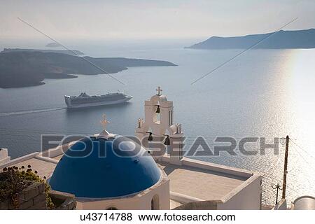 Stock Photo - "View of church and car ferry, Oia, Santorini, Cyclades, Greece". Fotosearch