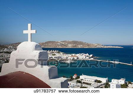 Stock Photo - "View of church roof and sea, Mykonos, Cyclades, Greece". Fotosearch