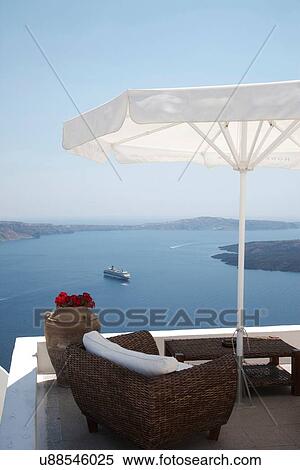 "View of rooftop terrace and sea ferry, Oia, Santorini, Cyclades, Greece" View Large Photo Image Stock Photography - "View of rooftop terrace and sea ferry, Oia, Santorini, Cyclades, Greece". Fotosearch