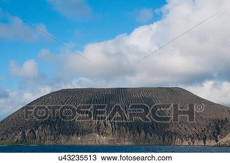 Stock Image - "View of San Benedicto Island with ash formation along the crater of its inactive volcano, Revillagigedo, Mexico". Fotosearch