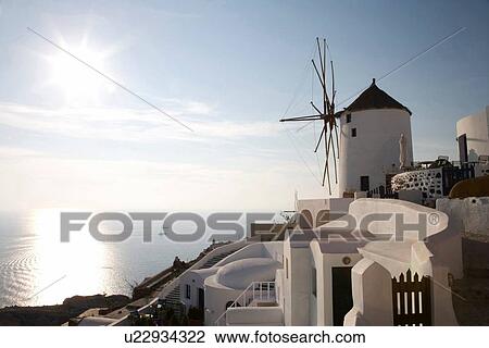 "View of windmill on hillside, Oia, Santorini, Cyclades, Greece" View Large Photo Image Stock Image - "View of windmill on hillside, Oia, Santorini, Cyclades, Greece". Fotosearch