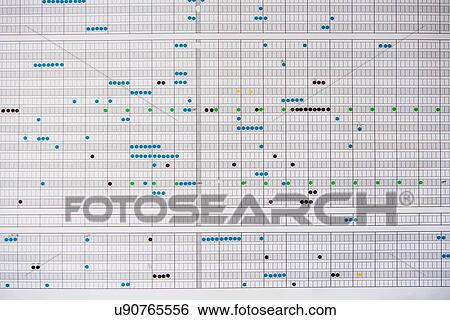 Stock Photograph - Wall planner covered with stickers. Fotosearch