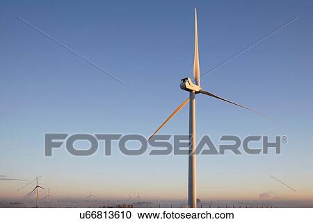 Wind turbine against blue sky View Large Photo Image Stock Image - Wind turbine against blue sky. Fotosearch