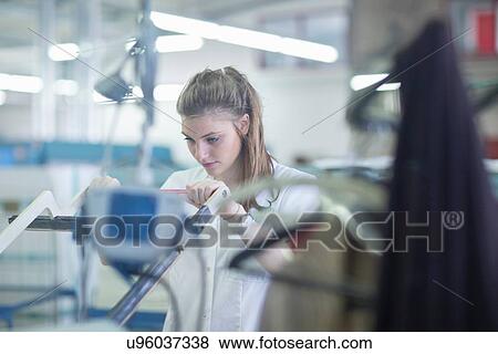 Woman at press machine in laundry View Large Photo Image Stock Photo - Woman at press machine in laundry. Fotosearch