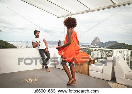 "Woman dancing on terrace, Sugarloaf Mountain in background, Rio, Brazil" View Large Photo Image Stock Image - "Woman dancing on terrace, Sugarloaf Mountain in background, Rio, Brazil". Fotosearch