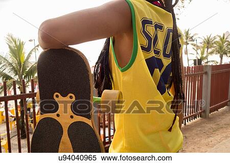 "Woman leaning on skateboard, Ipanema, Rio de Janeiro, Brazil" View Large Photo Image Stock Photography - "Woman leaning on skateboard, Ipanema, Rio de Janeiro, Brazil". Fotosearch