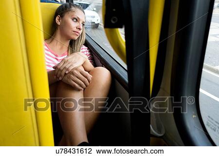 "Woman looking out of bus window, Rio de Janeiro, Brazil" View Large Photo Image Stock Image - "Woman looking out of bus window, Rio de Janeiro, Brazil". Fotosearch