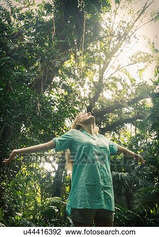 Woman relaxing in forest View Large Photo Image Stock Image - Woman relaxing in forest. Fotosearch
