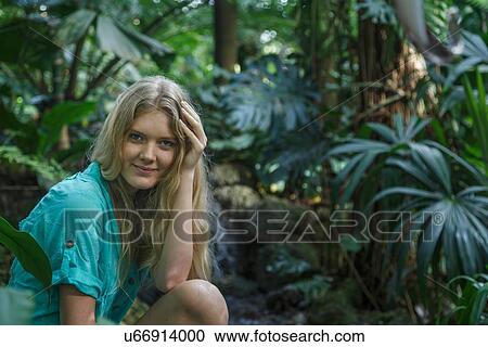 Woman relaxing in forest View Large Photo Image Stock Image - Woman relaxing in forest. Fotosearch