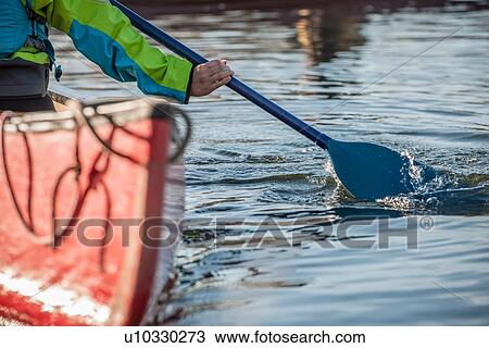 Woman steering canoe View Large Photo Image Stock Image - Woman steering canoe. Fotosearch