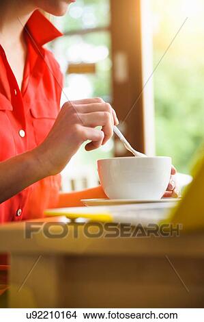 Woman using laptop at coffee break View Large Photo Image Picture - Woman using laptop at coffee break. Fotosearch
