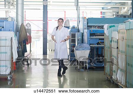 Stock Image - Woman working in laundry. Fotosearch