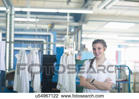 Stock Image - Woman working in laundry. Fotosearch