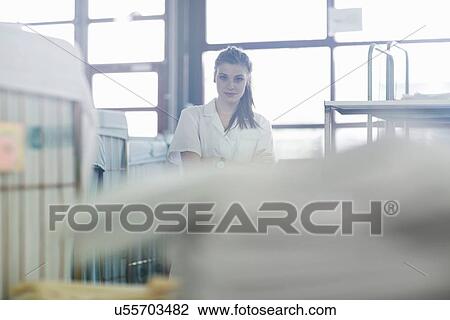Woman working in laundry View Large Photo Image Stock Image - Woman working in laundry. Fotosearch