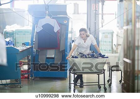 Stock Photo - Woman working in laundry. Fotosearch